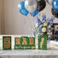 Graduation party tabletop decor set: wooden blocks in green and gold, glittered letter blocks with 'Congrats' banner and tie tr