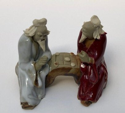 Ceramic FigurineTwo Men Sitting On A BenchColor: White & Red