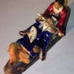 Ceramic FigurineMan & Woman Relaxing On A Bench