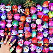 Hekaty 50Pcs 3D Christmas Light Up Rings Toy Christmas Party Favors Flash Finger Ring For Kid Ring Glow In The Dark Party Supplies Christmas Stocking Stuffers Christmas Gifts Christmas Party Toy Rings